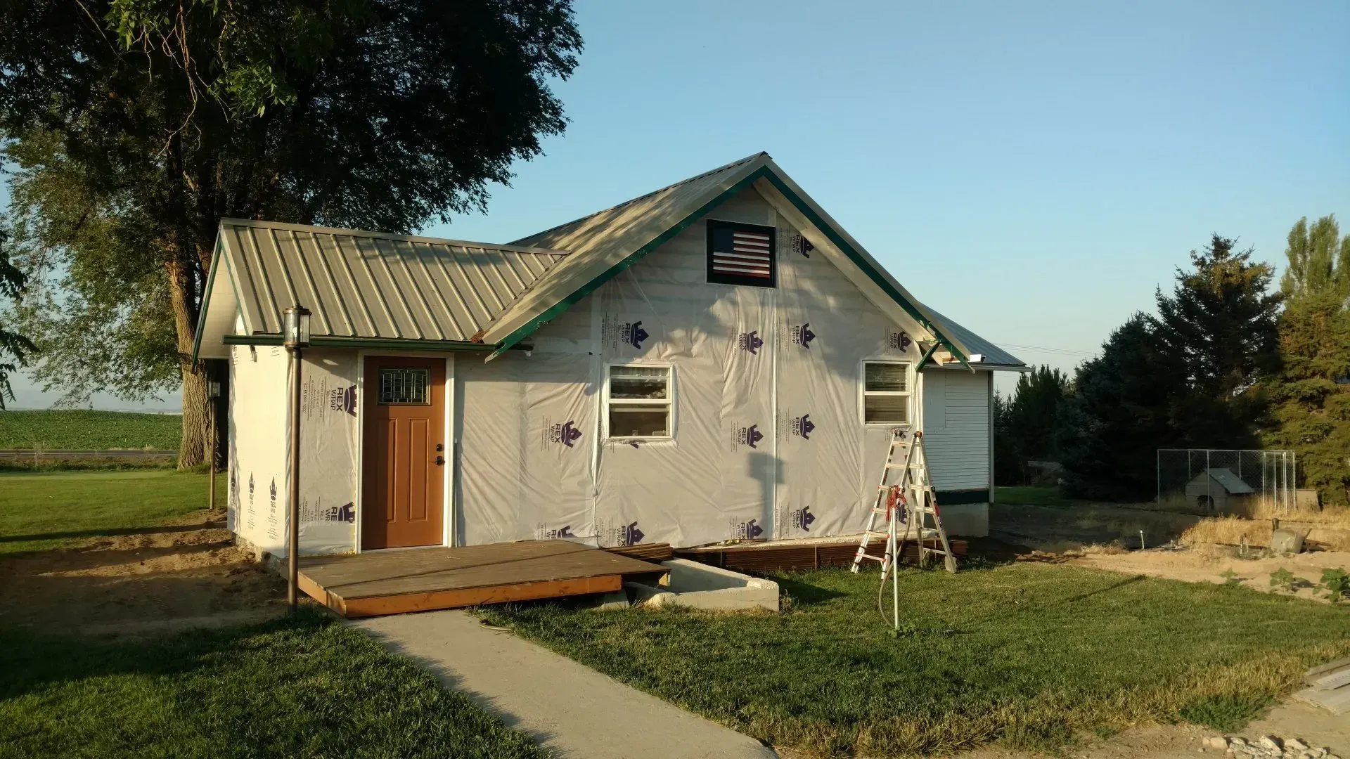 A small house with a ladder in front of it