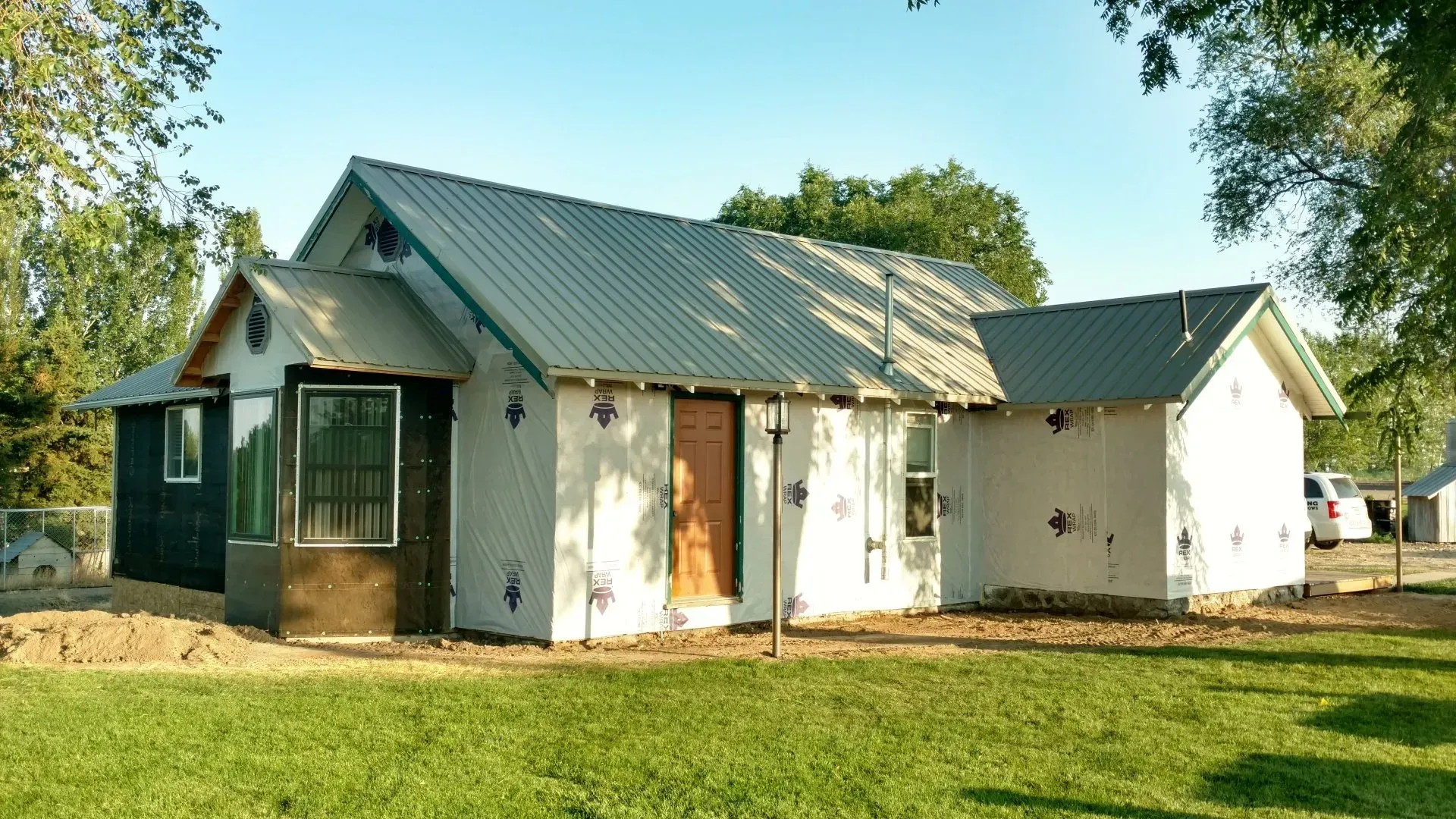 A house that is being built with a metal roof