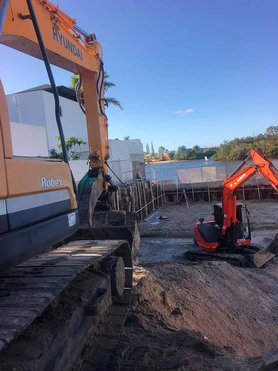 A Couple Of Excavators Are Working On A Construction Site — A2Z Property Services In Kenilworth, QLD