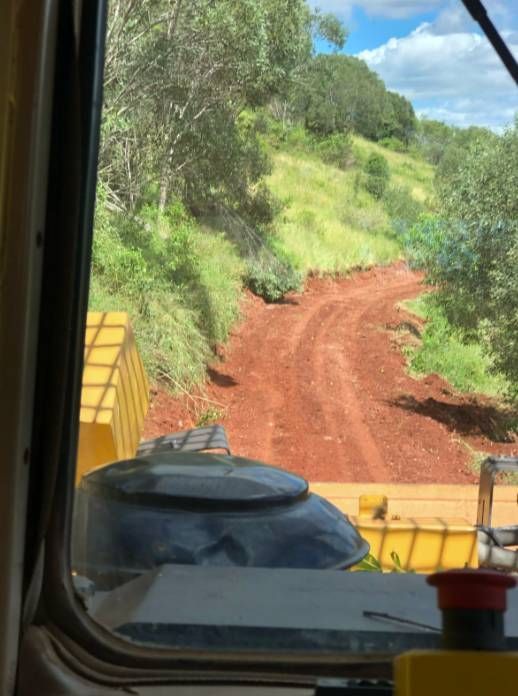A Dashboard View From A Tractor Looking At A Dirt Road — A2Z Property Services In Kybong, QLD