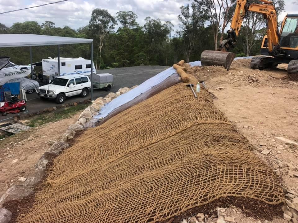 A Erosion Control Mat Covers a Sloped Construction Site — A2Z Property Services In Cooroy, QLD