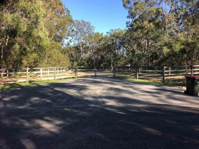 There Is A Trash Can In The Middle Of The Road — A2Z Property Services In Widgee, QLD