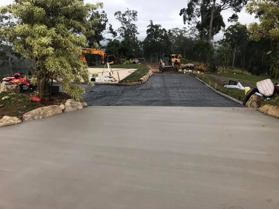 A Poured Concrete Driveway with Gravel Path — A2Z Property Services In Cooroy, QLD