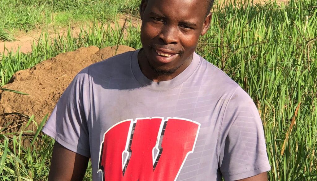Man in gray shirt with red 