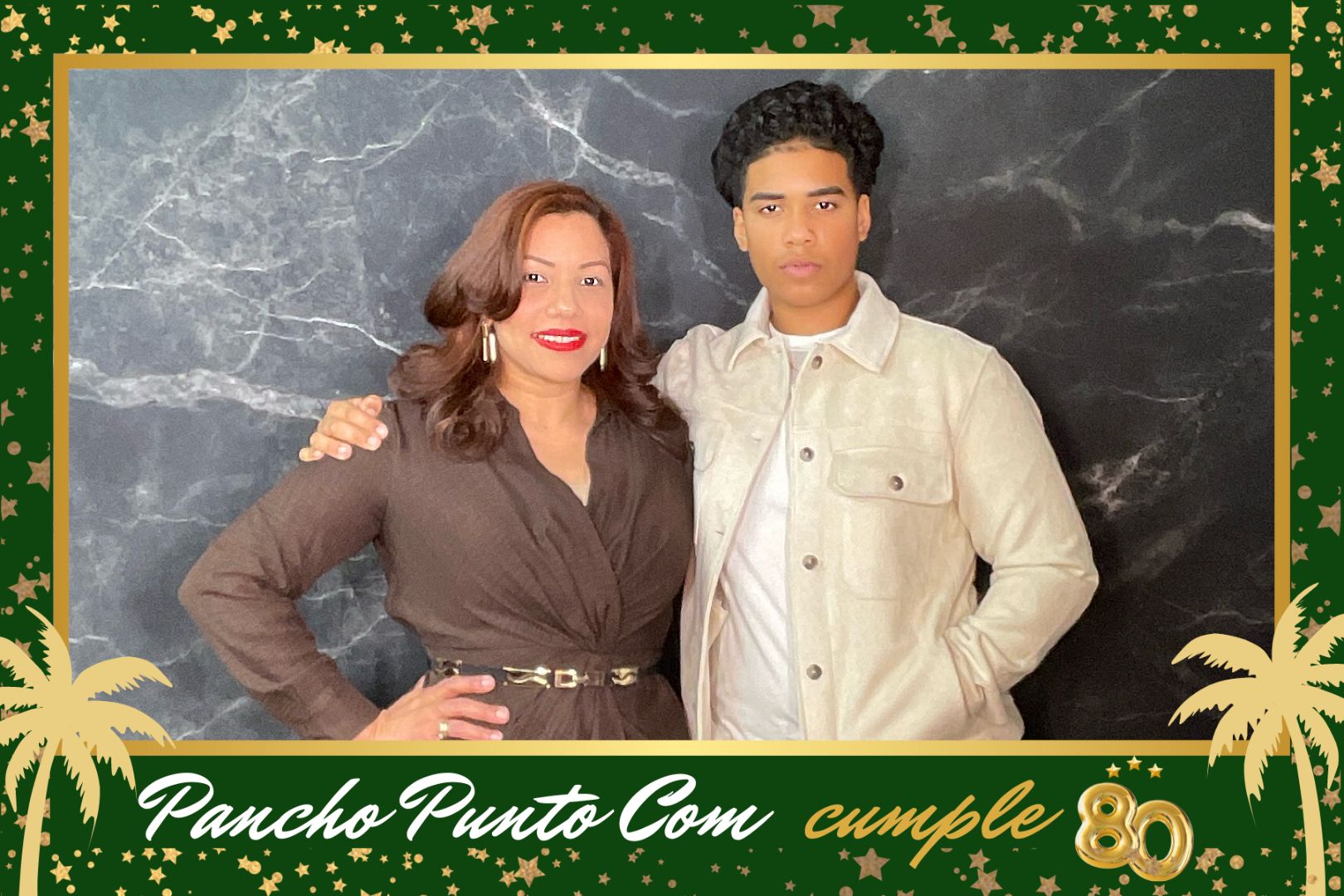 A man and a woman are posing for a picture in a photo booth.