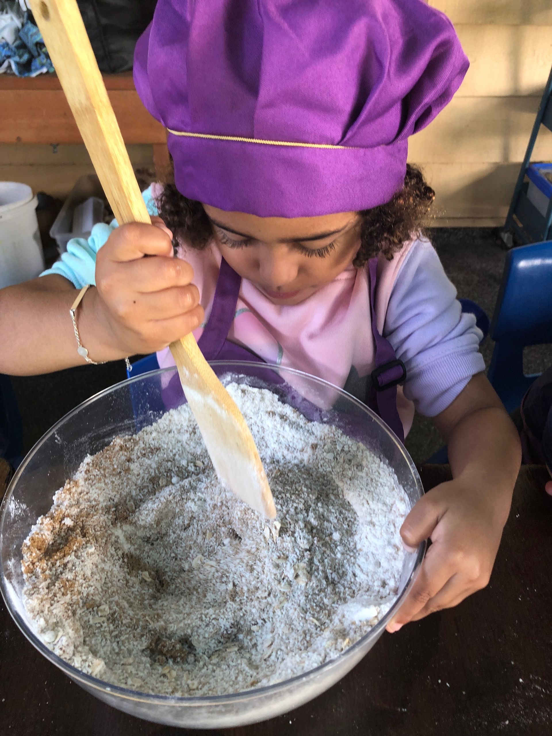 Children Are Standing In The Grass Wearing Safety Vests And Hats – Bundaberg North, QLD - Cradle to Crayons Education & Care