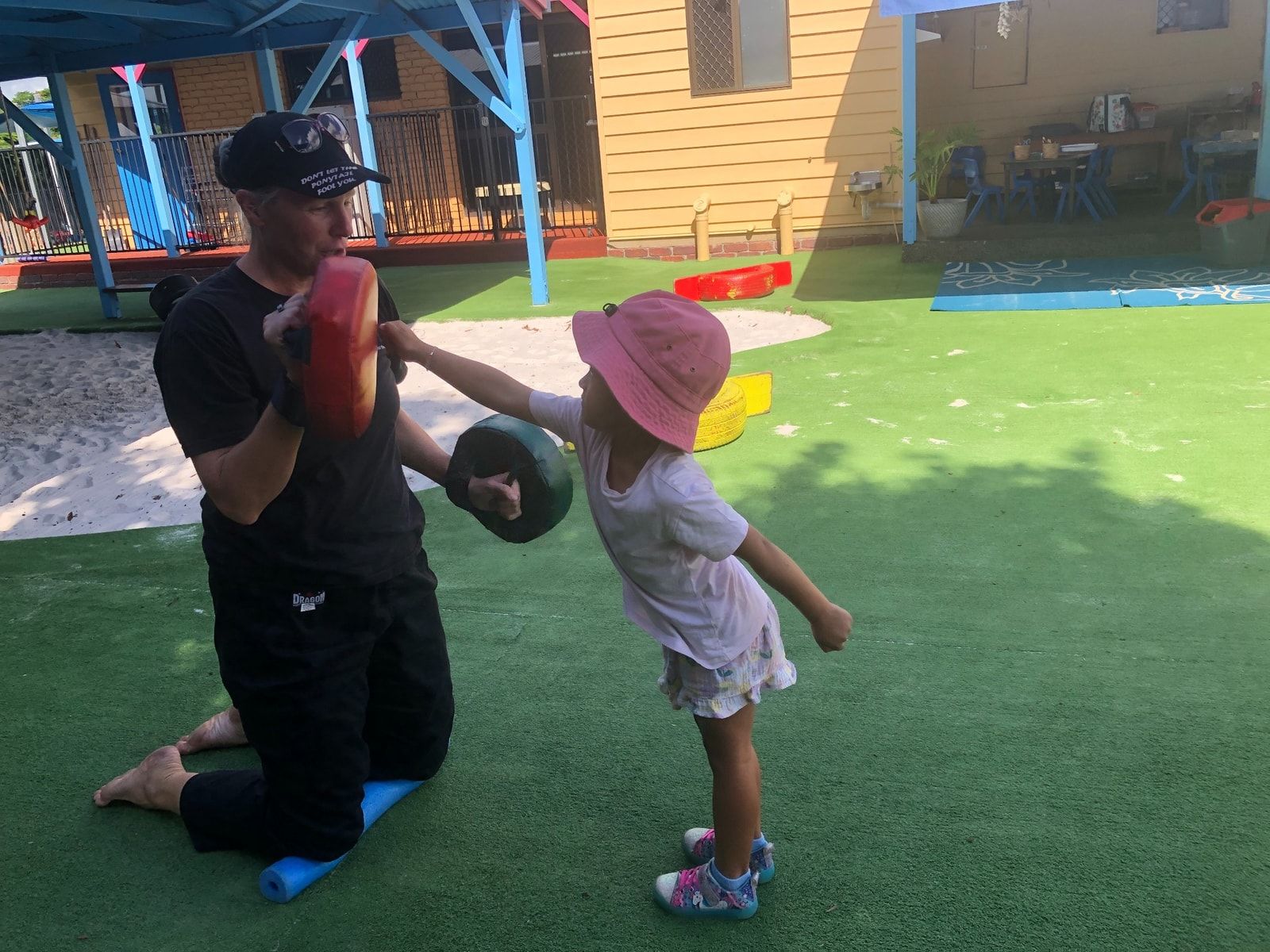 A Young Boy Is Sitting At A Table Playing With Play Dough – Bundaberg North, QLD - Cradle to Crayons Education & Care