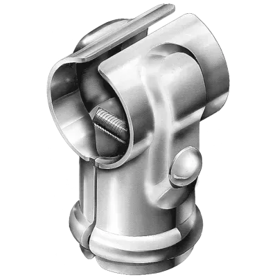 A tall, gray metal privacy fence runs along a sidewalk and grass verge, with green trees visible in the background.