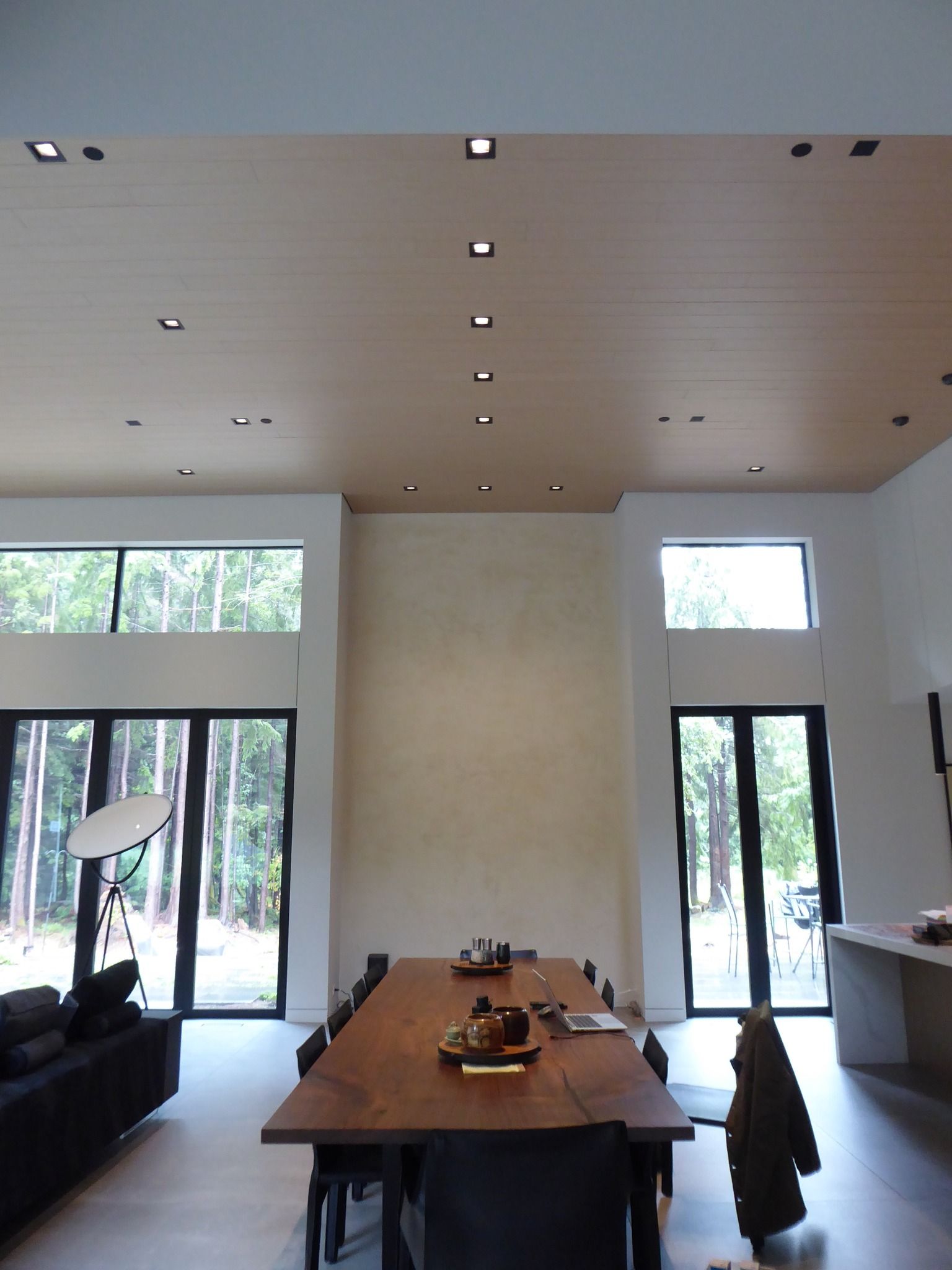 A dining room with a long table and chairs
