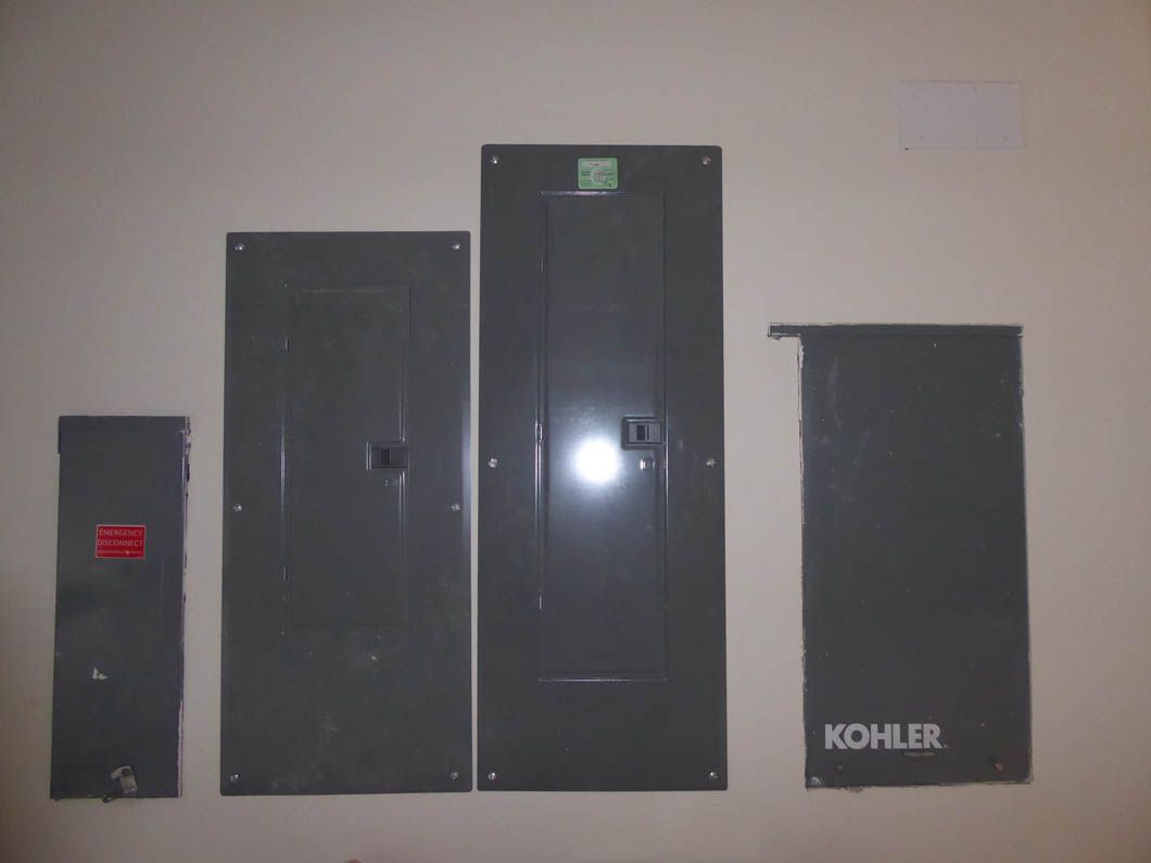 A row of kohler electrical panels on a wall