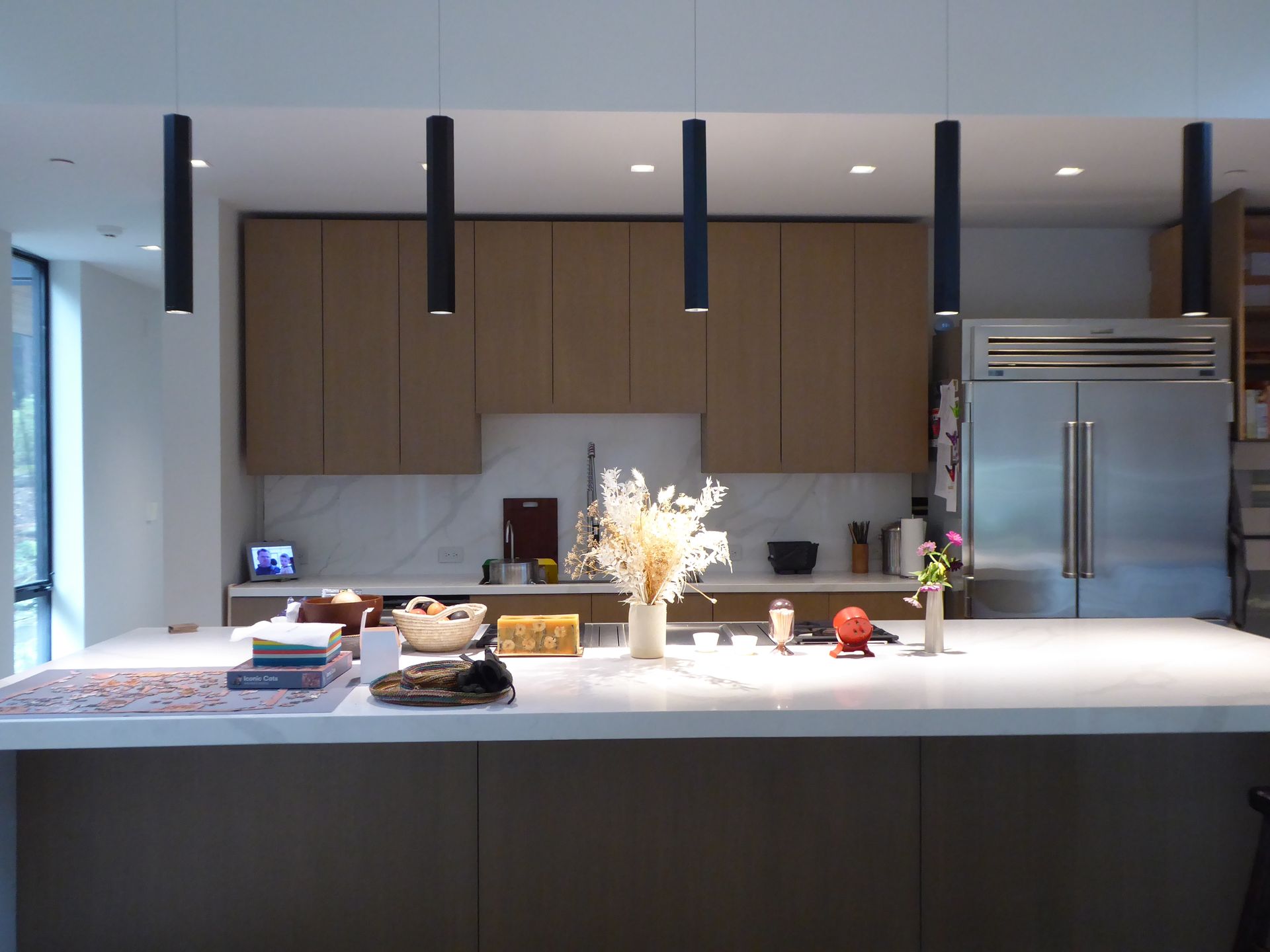 A kitchen with stainless steel appliances and wooden cabinets