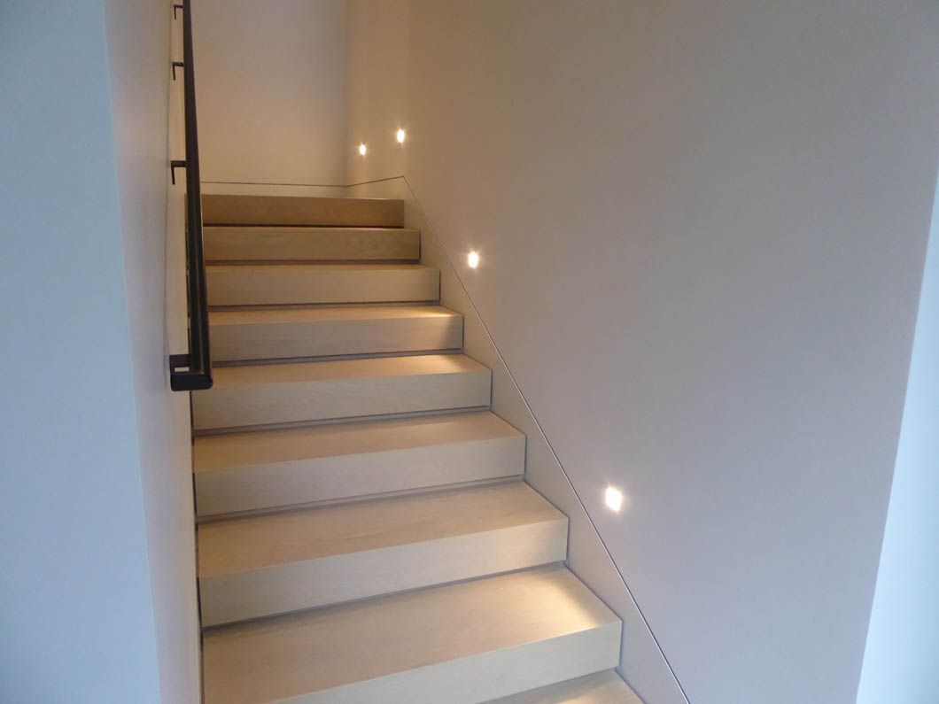 A set of stairs leading up to the second floor of a house.