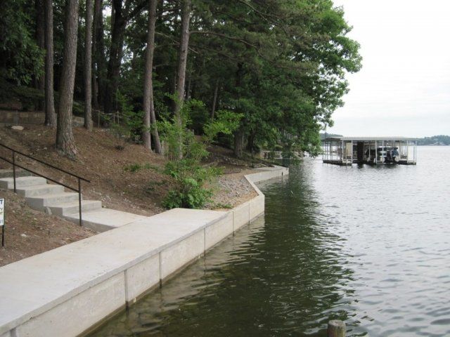 A large body of water with a dock in the background