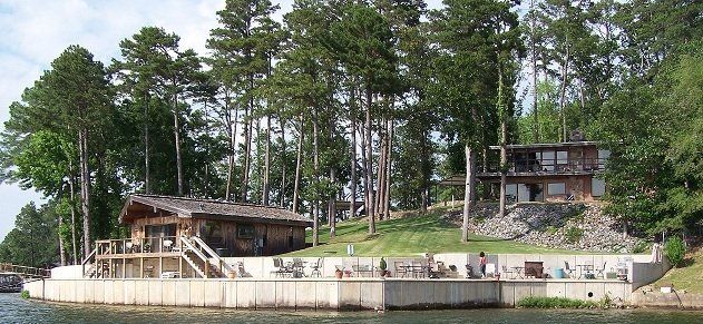 A house on a small island in the middle of a lake