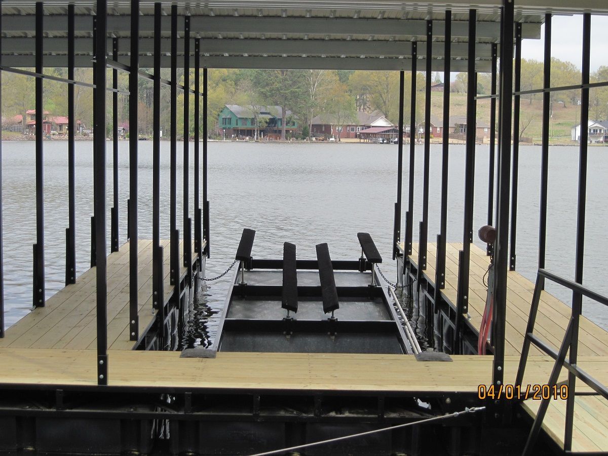 A boat is docked at a dock on a lake