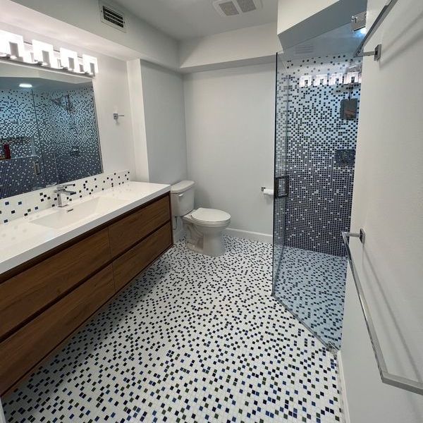 Mosaic Tile Bathroom renovated by RIM Express