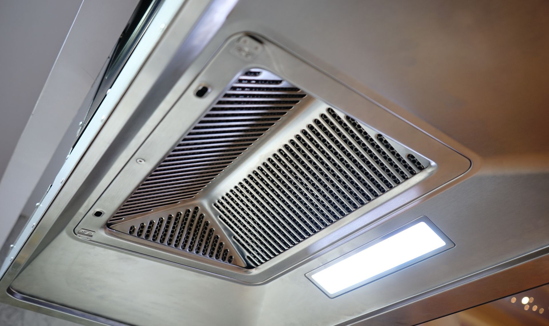 A close up of a ceiling fan with a light on it.