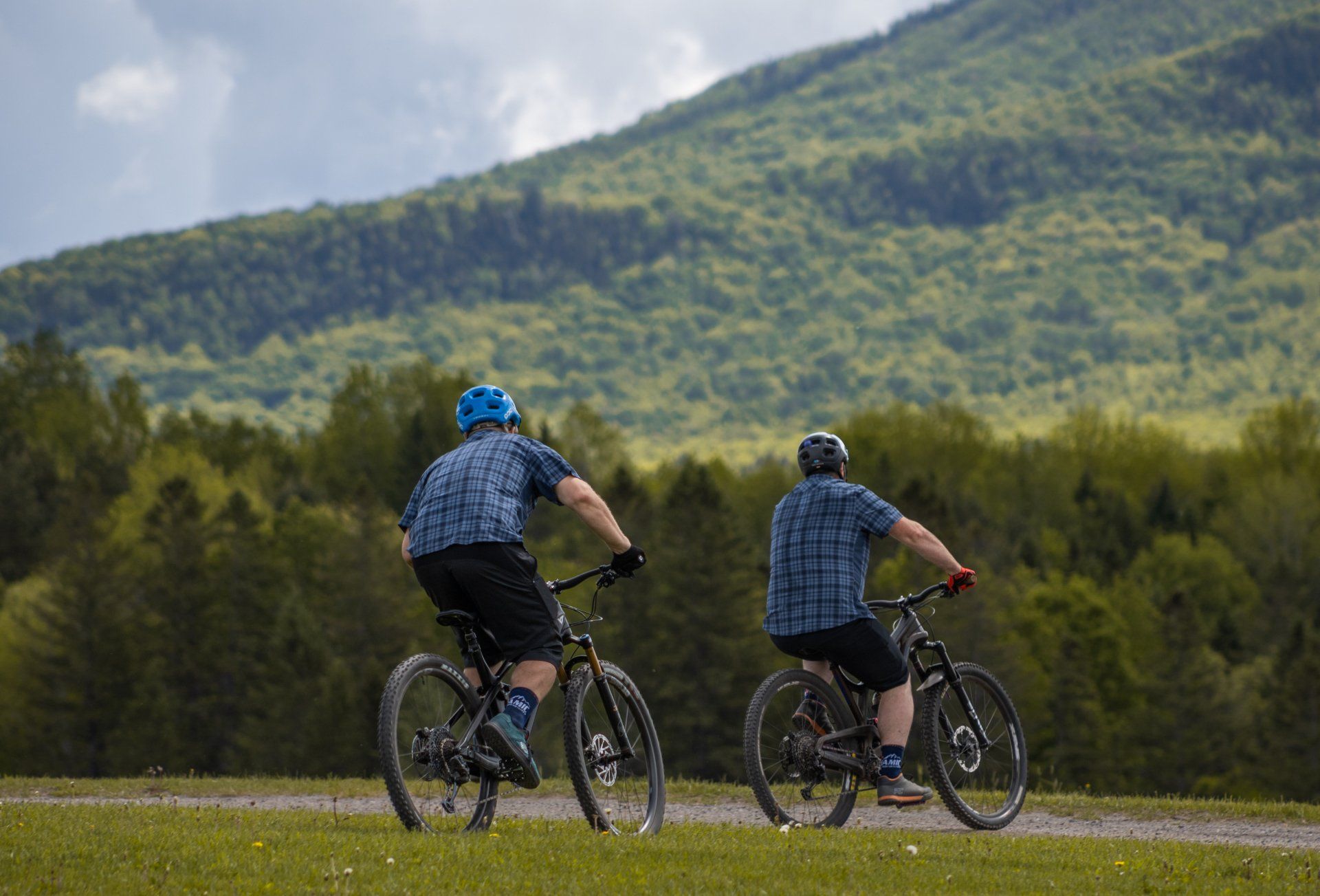 two Dynamic Cycling Adventures coaches riding during a clinic