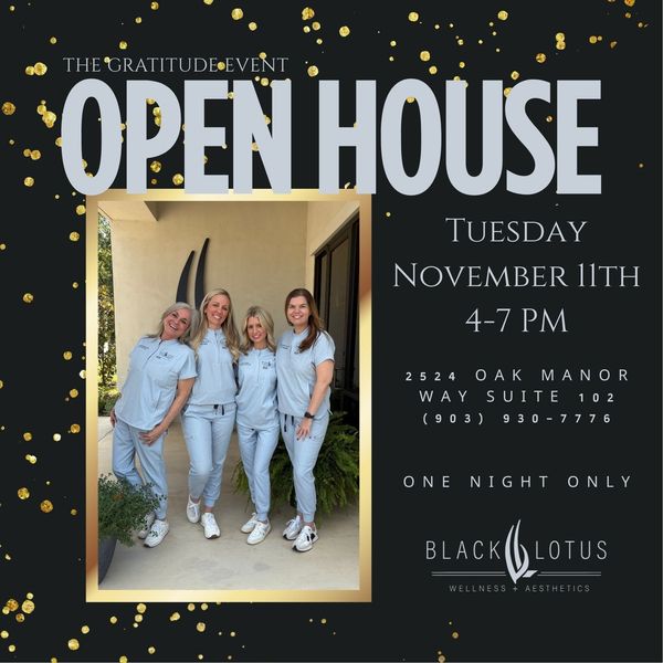 A syringe and two bottles of medicine on a pink background.