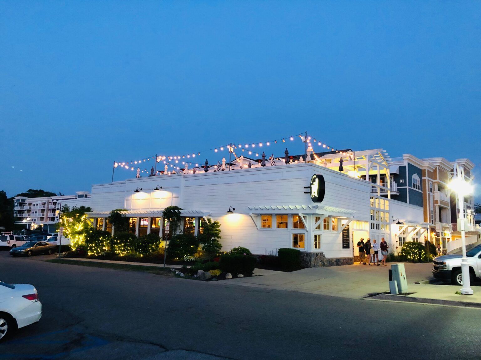 A white building with a lot of lights on top of it