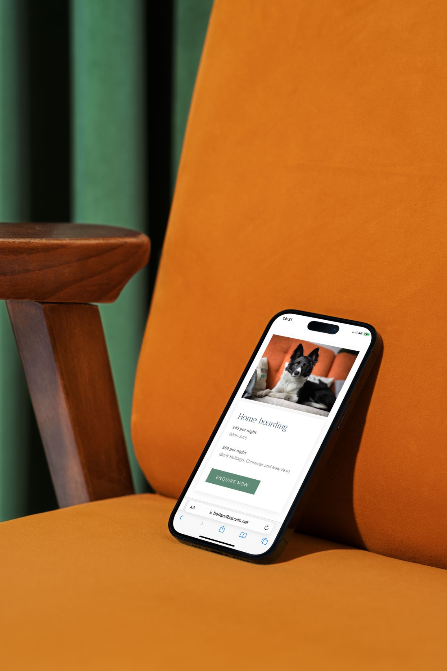 A cell phone is sitting on top of an orange chair.