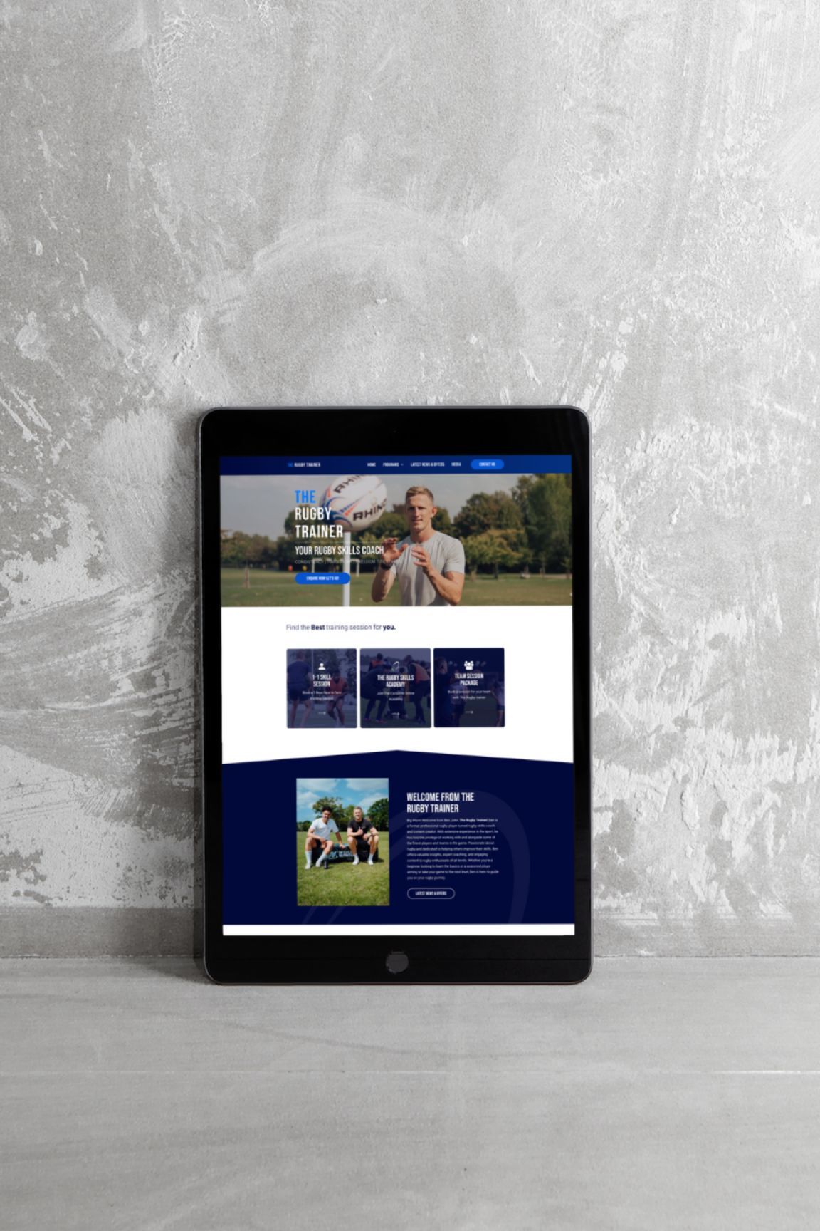 A tablet is displaying a website with a man on it