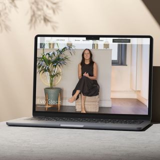 A laptop with a picture of a woman on the screen