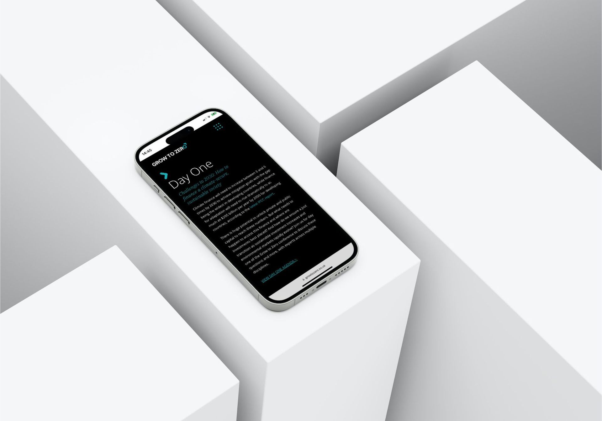 A cell phone sitting on top of a white cube