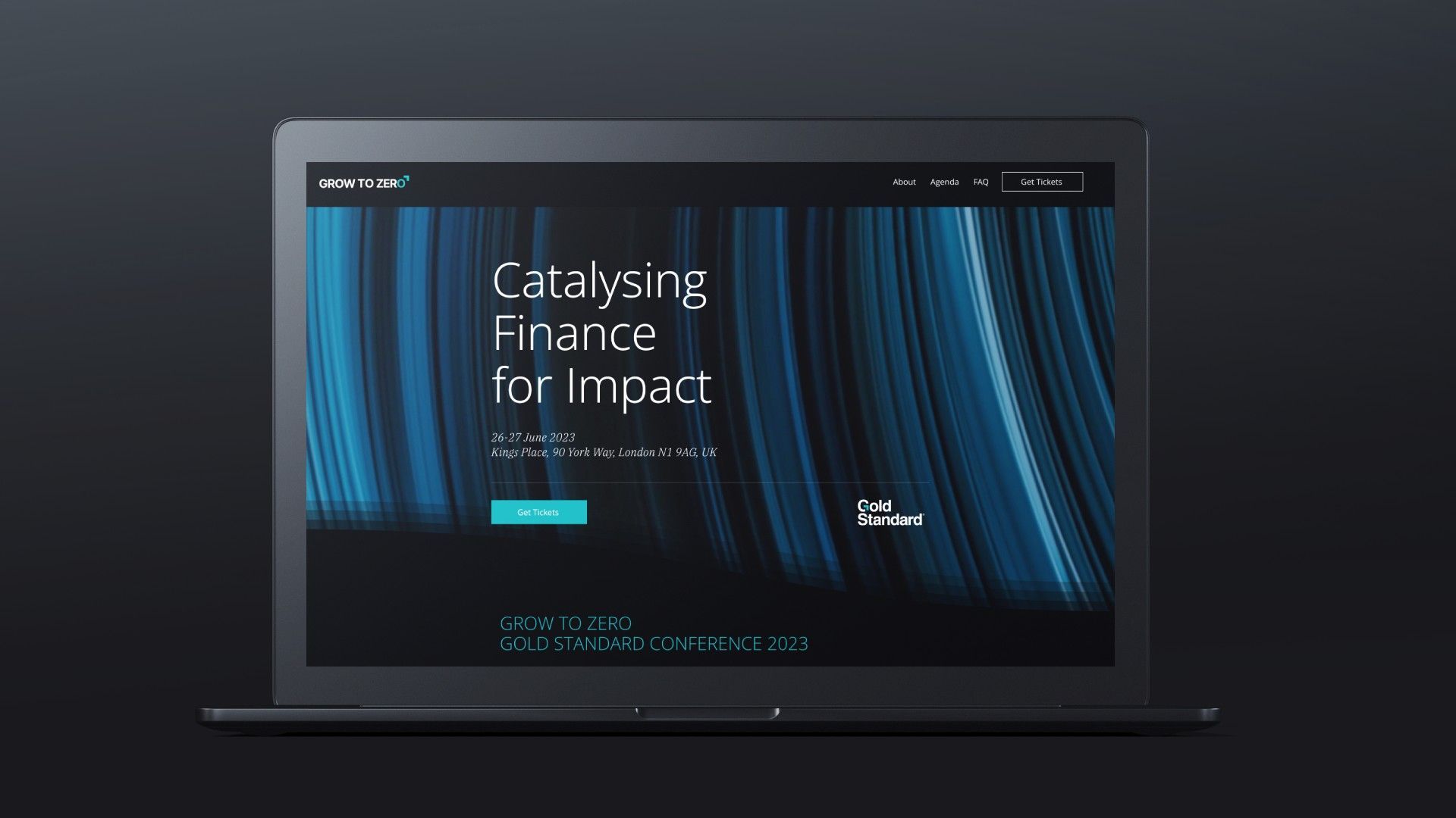A laptop computer is open to a page that says catalyst finance for impact.
