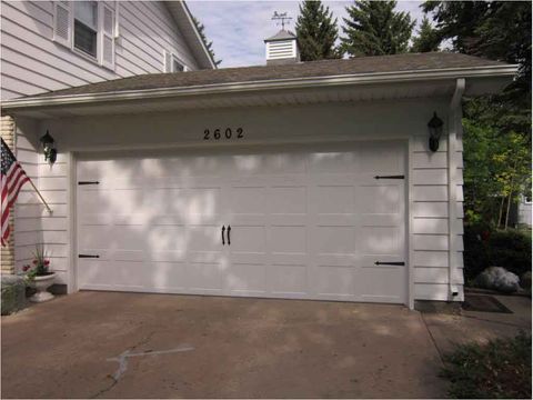 Garage Door Replacement — Closed-up View Of White Garage Door in Fargo, ND
