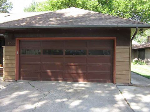 Metal Garage Doors — Wooded Colored Garage Door With Glass in Fargo, ND