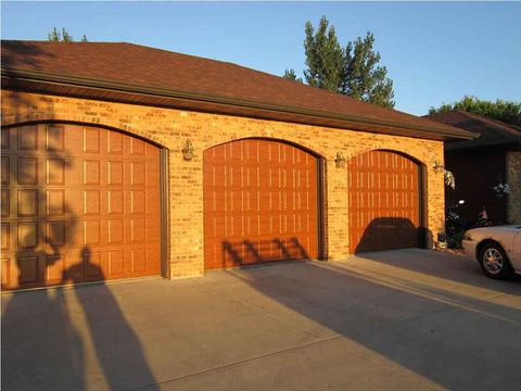 Residential Garage Repair Contractor — Garage Door With Sunset Effect in Fargo, ND