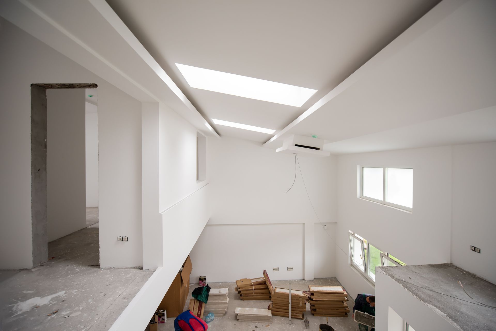 An empty room with a skylight on the ceiling