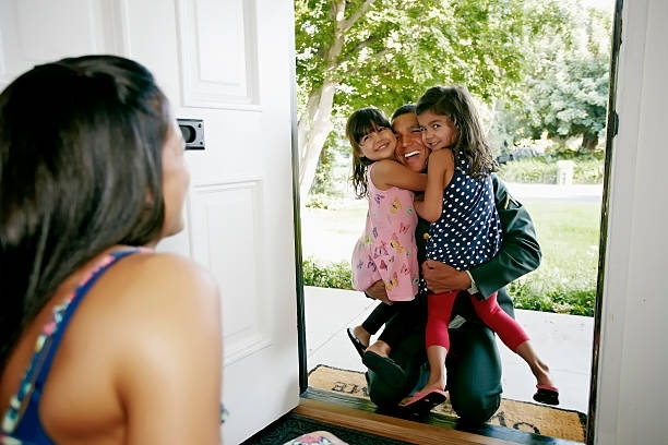 Father Holding His Two Daughter - Salinas, CA - Monterey Peninsula Bail Bonds