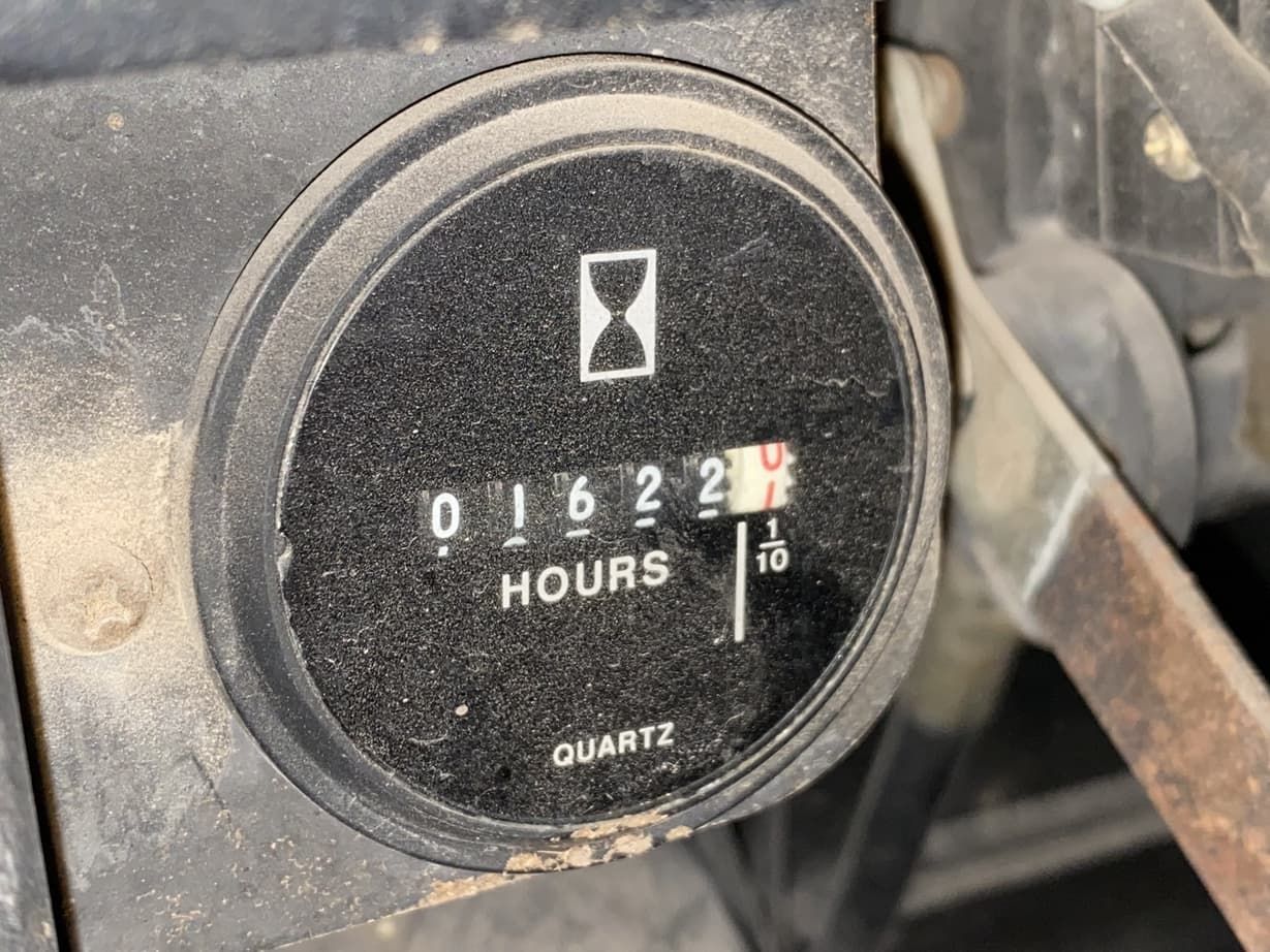 A close up of a quartz clock showing a few hours