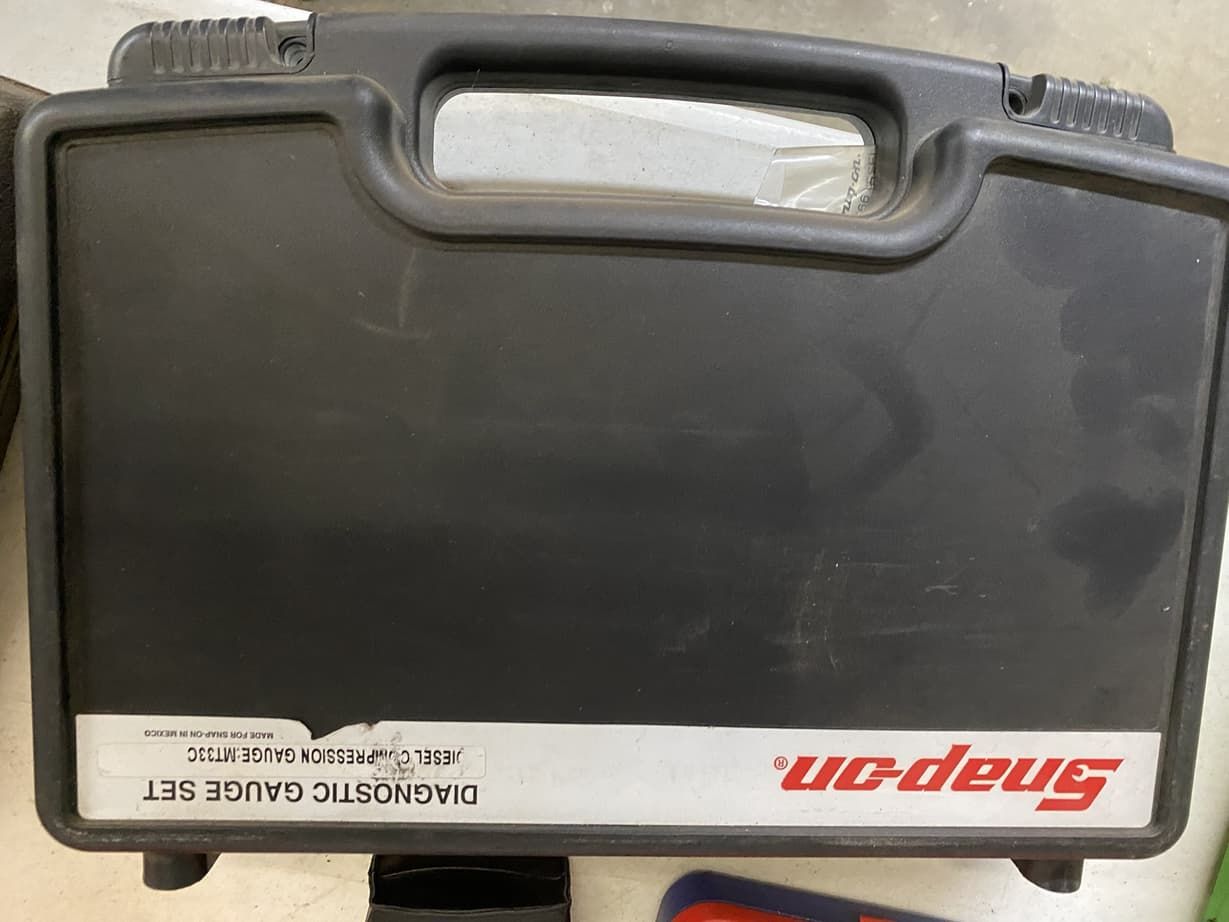 A snap on diagnostic gauge kit is in a black case