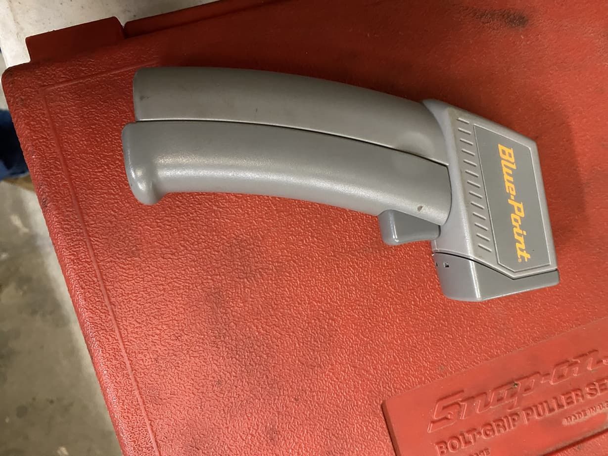 A blue point thermometer is sitting on top of a red box