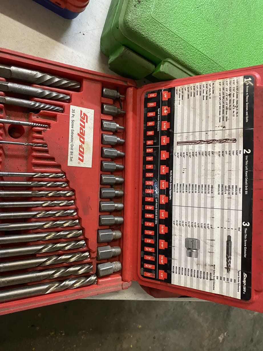 A snap on drill bit set is sitting on a table.