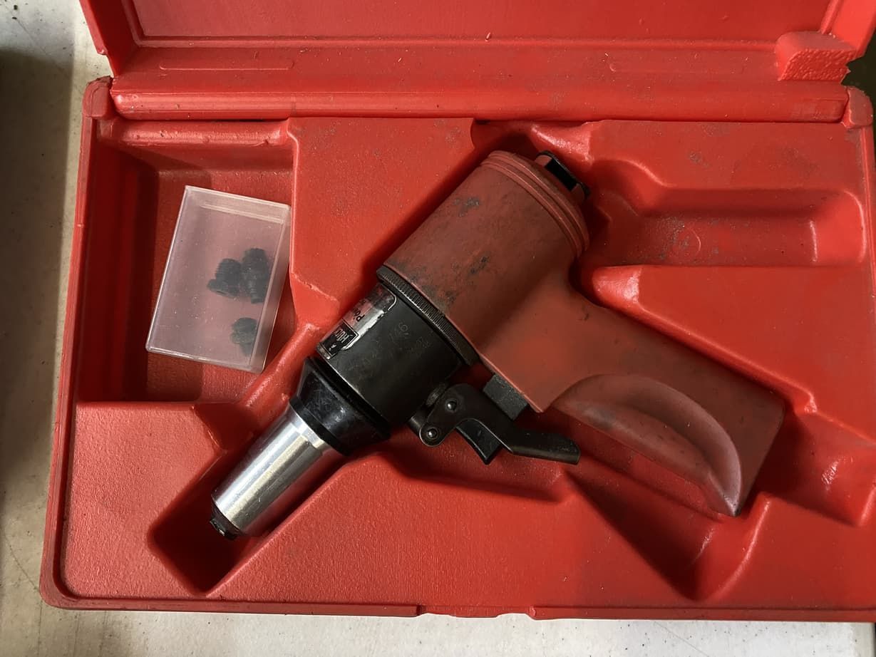 A red case with a tool inside of it