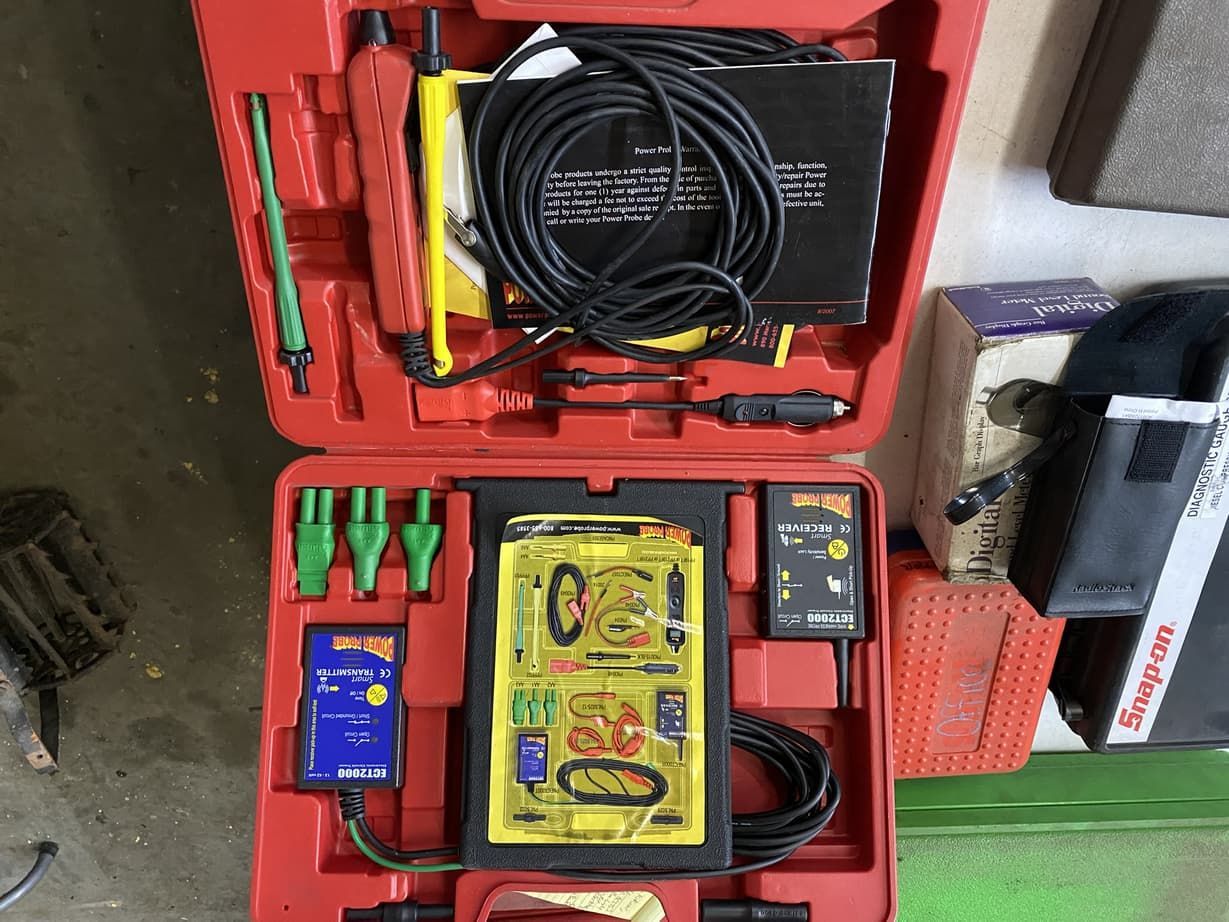A red case with a bunch of tools inside of it