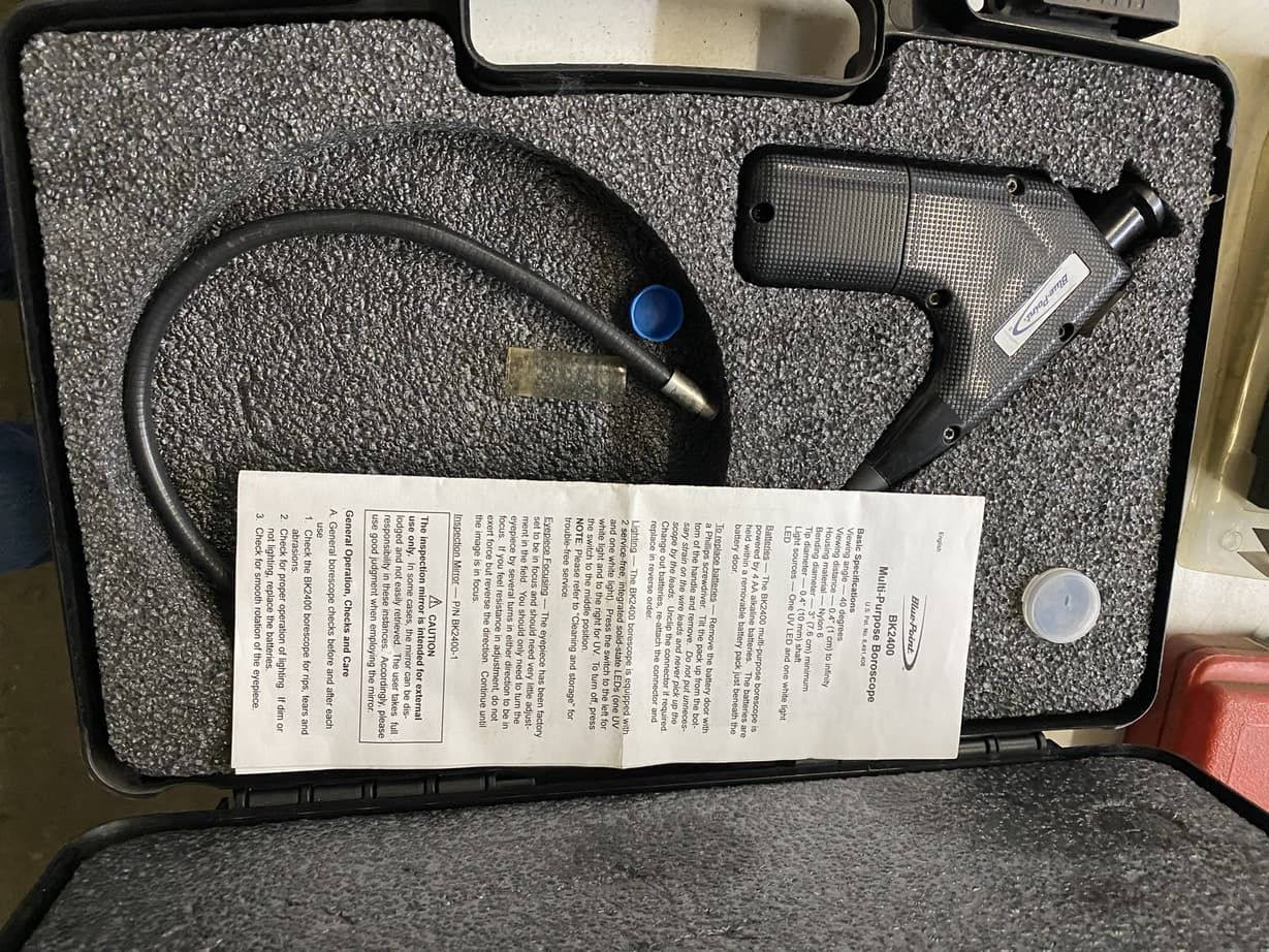 a black tool in a foam case