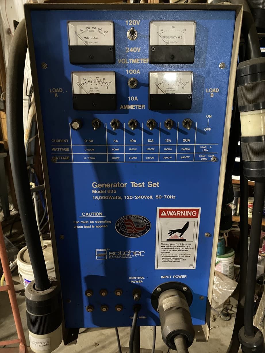 A blue device with a warning sign on it