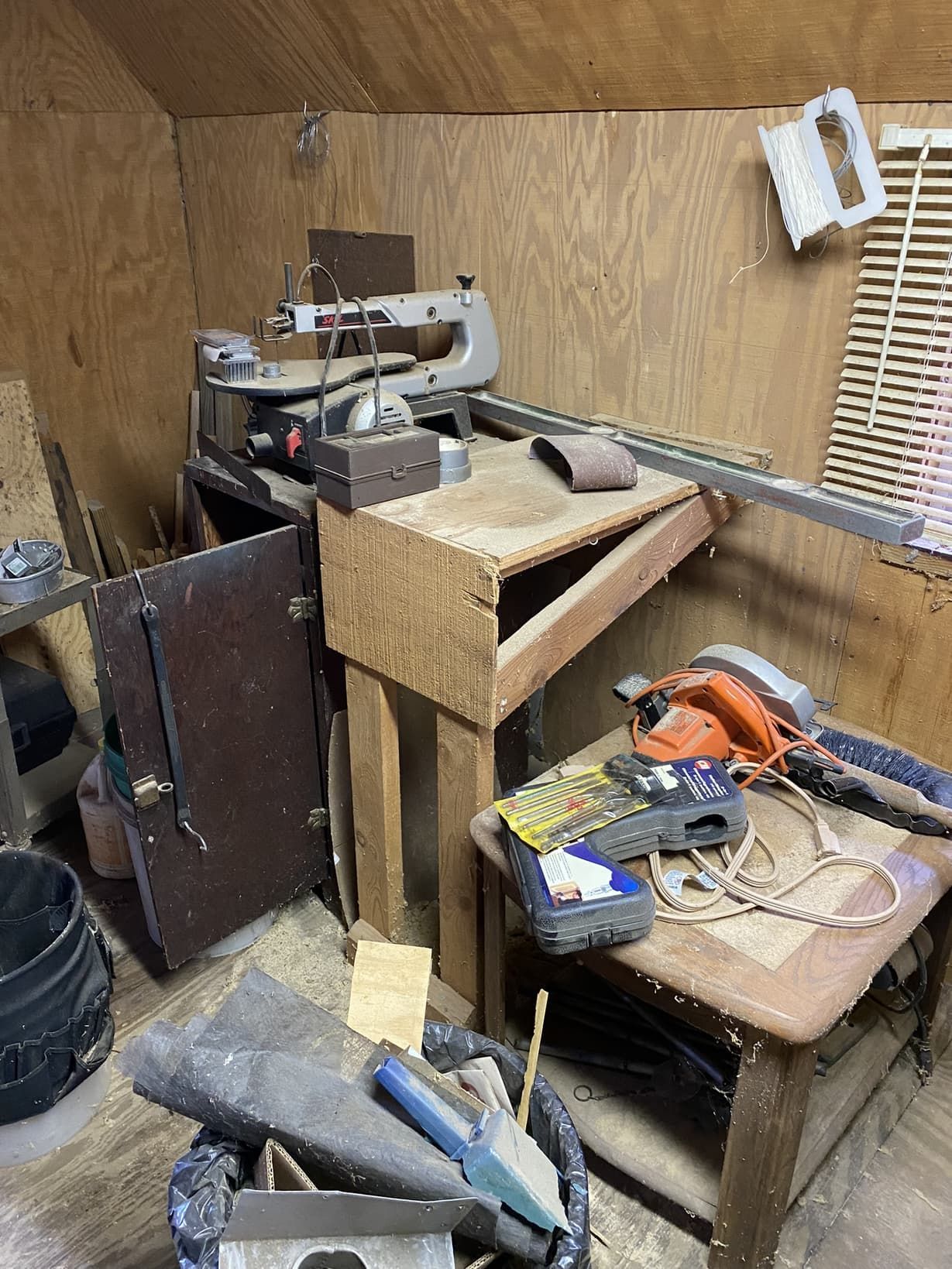 A room filled with lots of tools and a table.