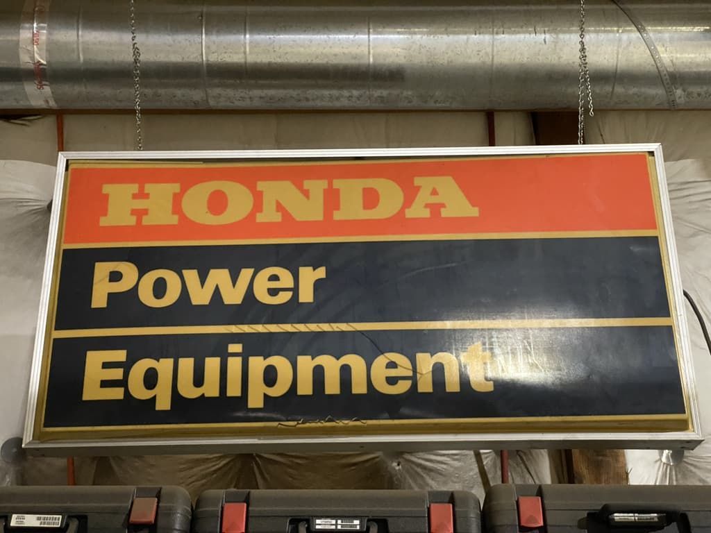 A honda power equipment sign hangs from the ceiling