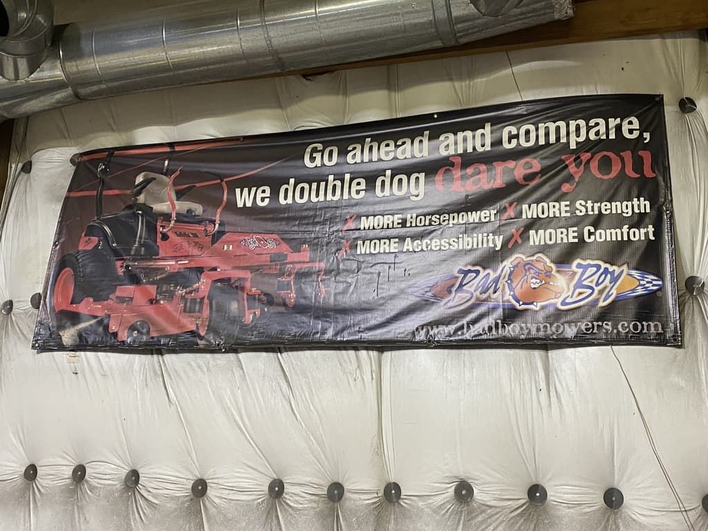 A sign on a wall that says `` go ahead and compare we double dog dare you ''