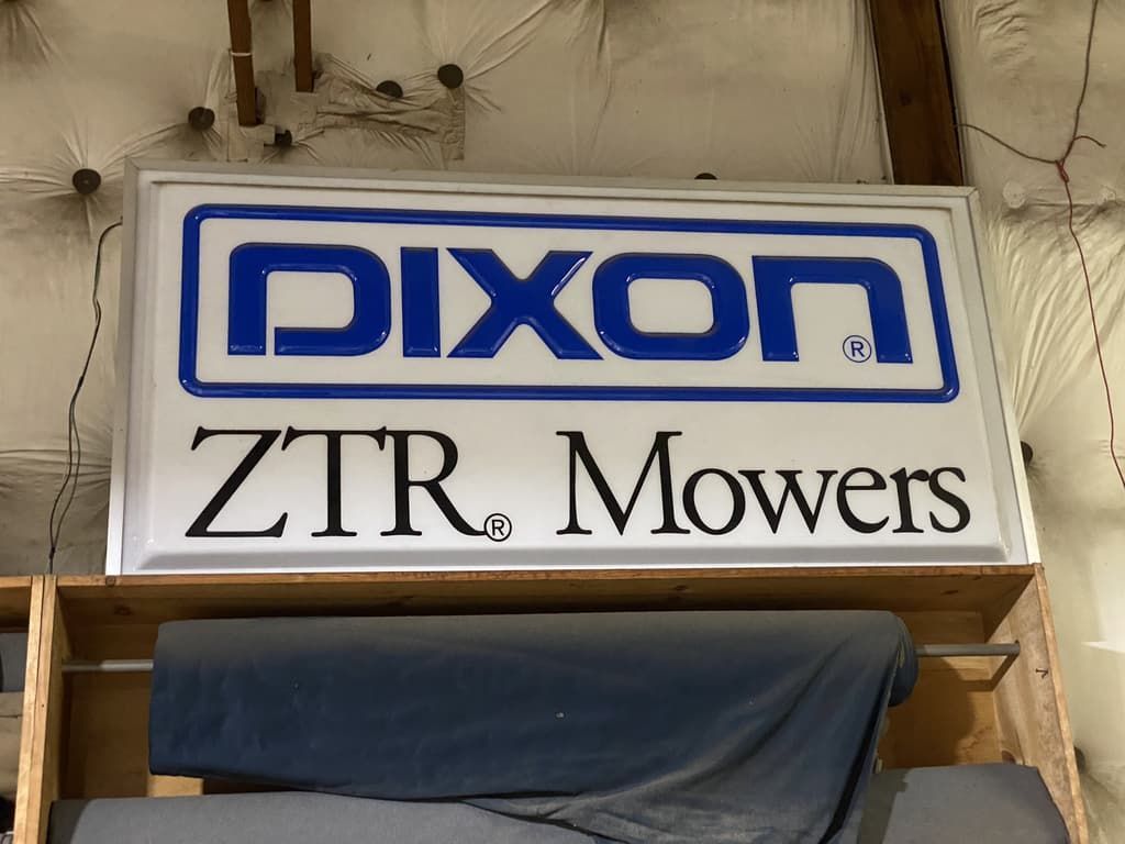 A sign that says dixon ztr mowers on it