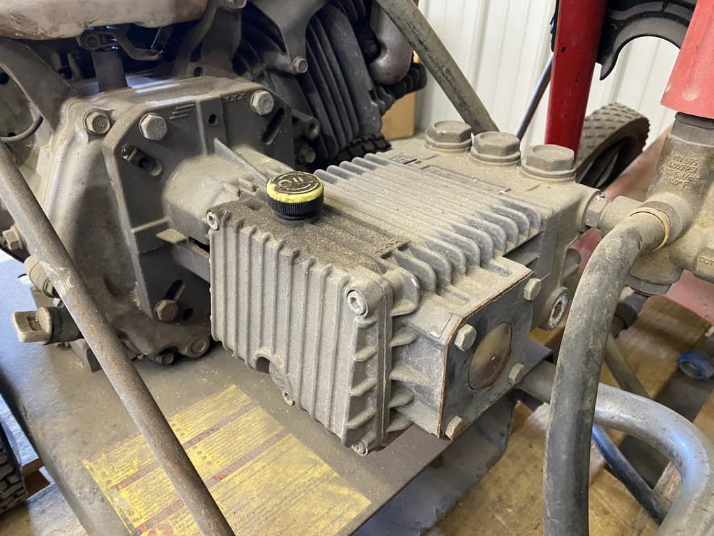 A close up of a machine with a yellow cap on it.