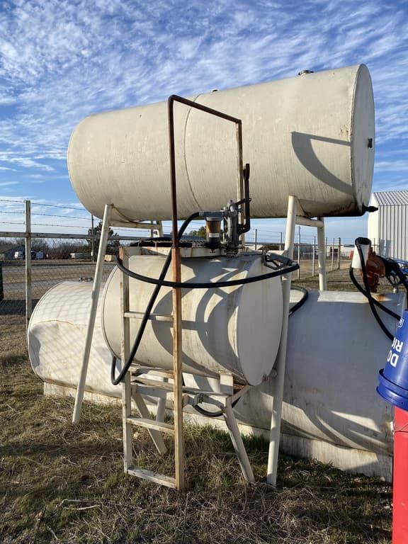 A large white tank with a ladder attached to it