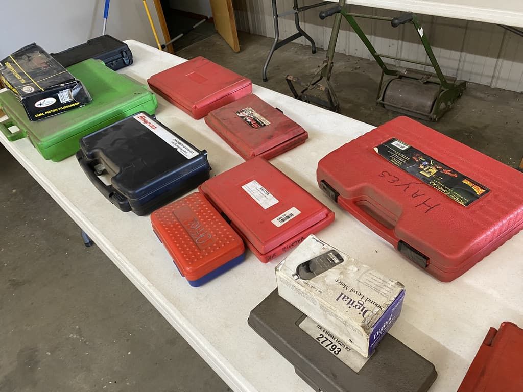 A table with a bunch of cases on it