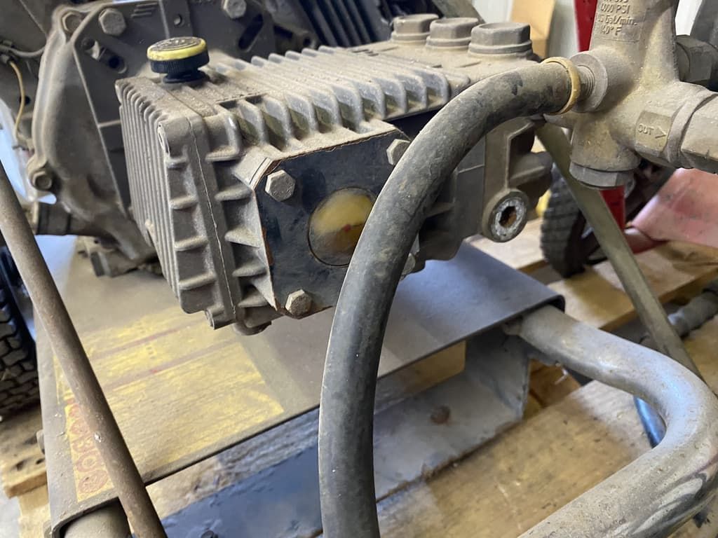 A close up of a machine with a hose attached to it.